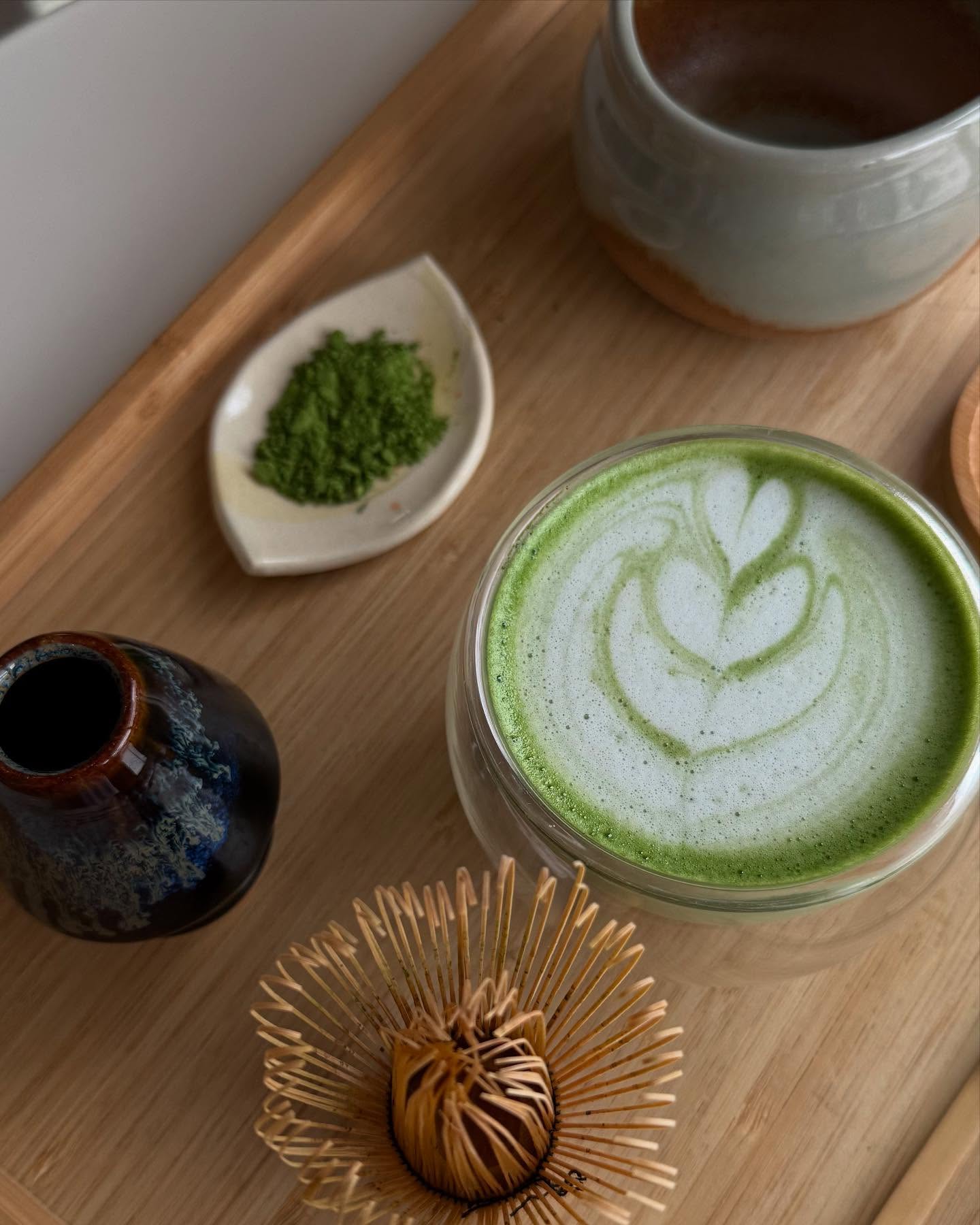 Matcha latte with heart latte art at Paulita's