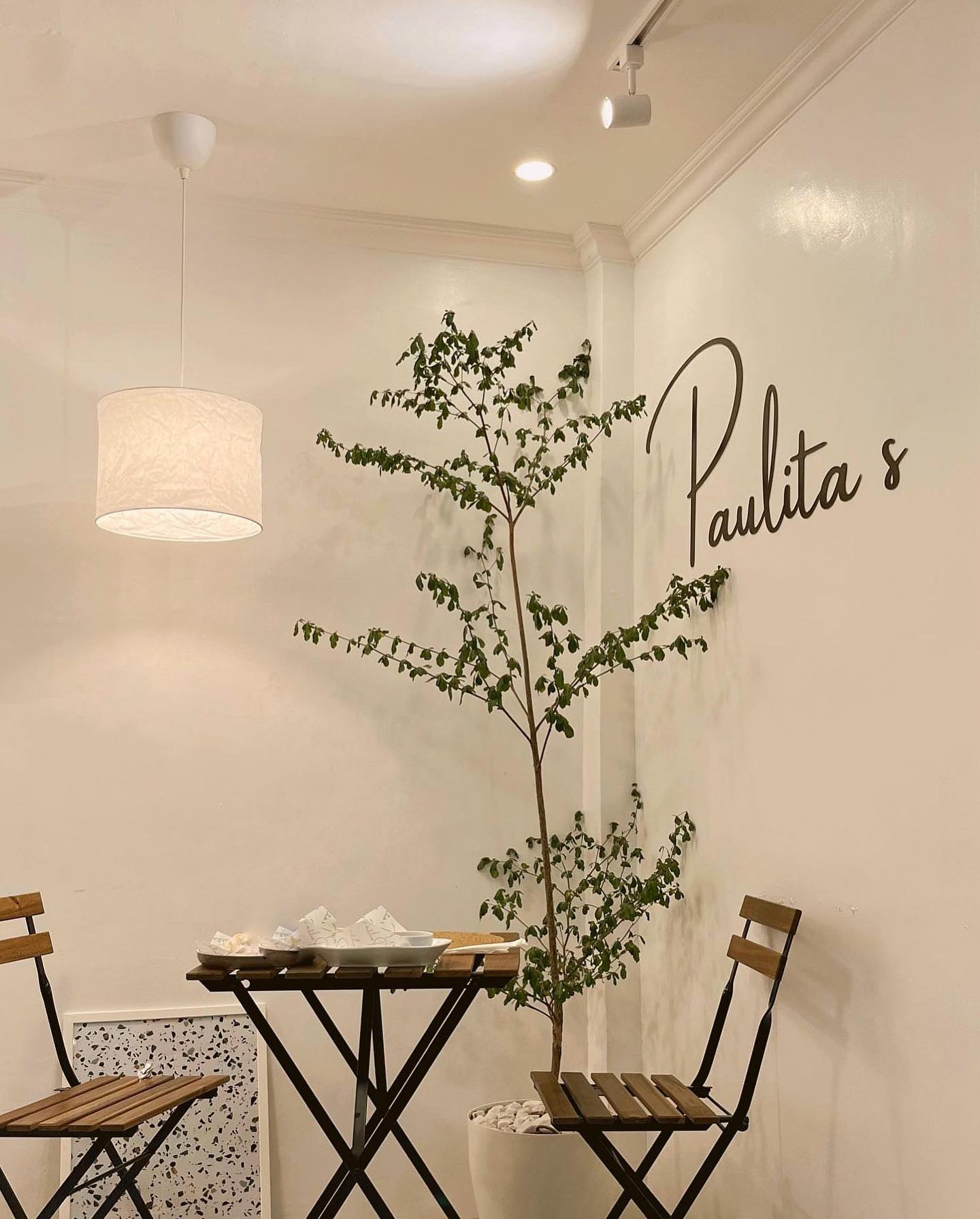 Paulita's wall signage and bistro seating